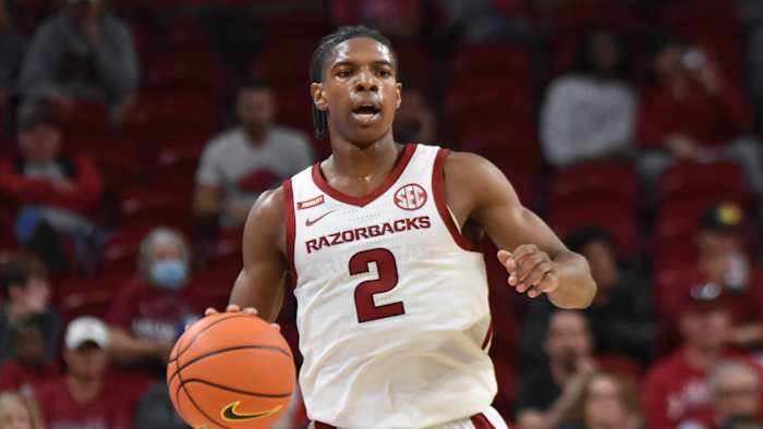 Former Arkansas Razorbacks guard KK Robinson brings the ball up the floor for the Hogs.